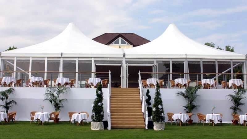 Twin pagoda VIP venue with glass panels.